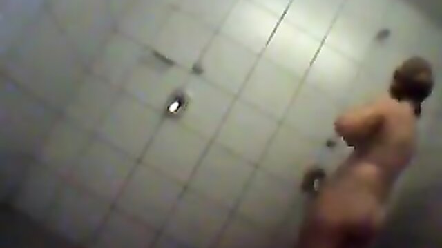 The wet and naked cougar in this voyeur showers video is simply irresistible