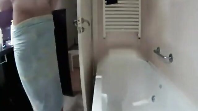 Hidden camera captures a nude couple showering in the bathroom